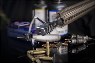 pegasus muzzle brake on barrel surrounded by ammo 