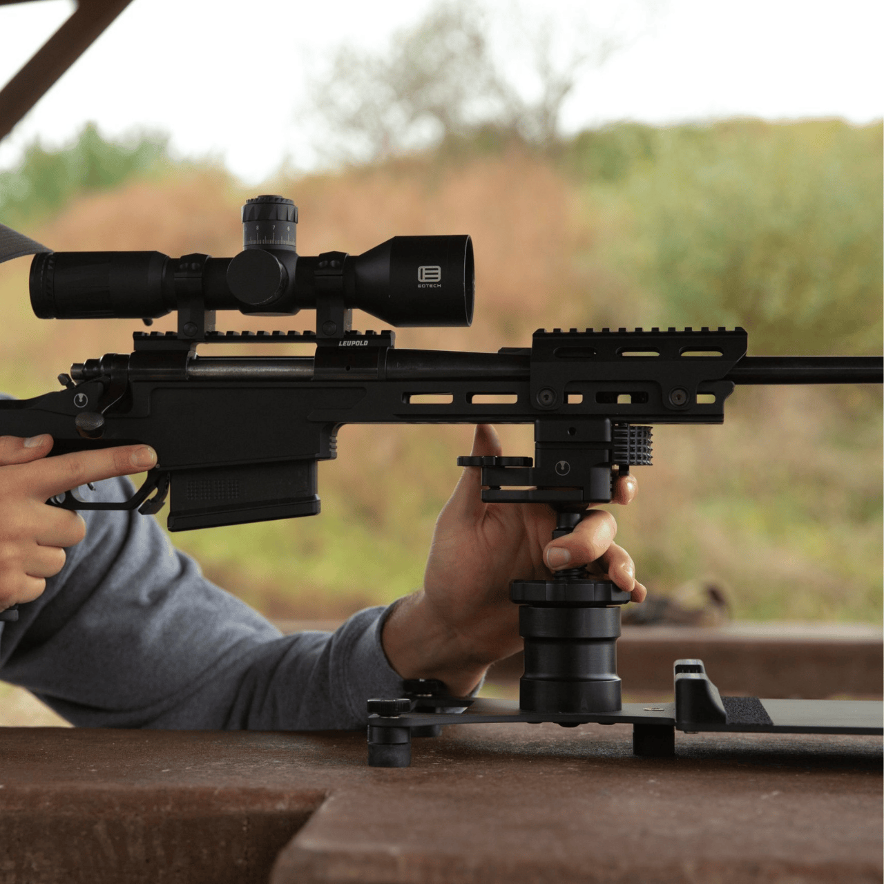 hands at the ready on rifle that is on UD launch pad