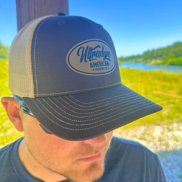 man's head as he wears an Ultradyne trucker hat