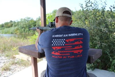 rear view of man wearing flag themed Ultradyne t-shirt