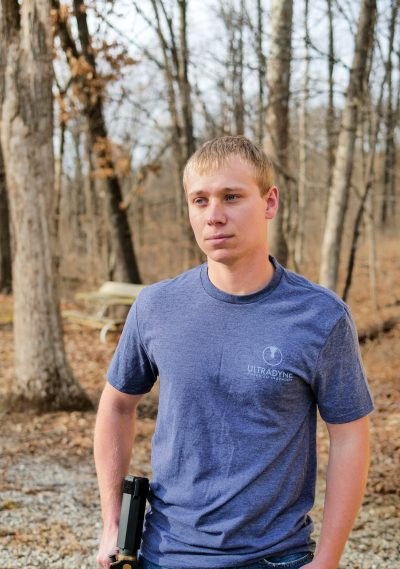 man wearing blue Ultradyne t-shirt