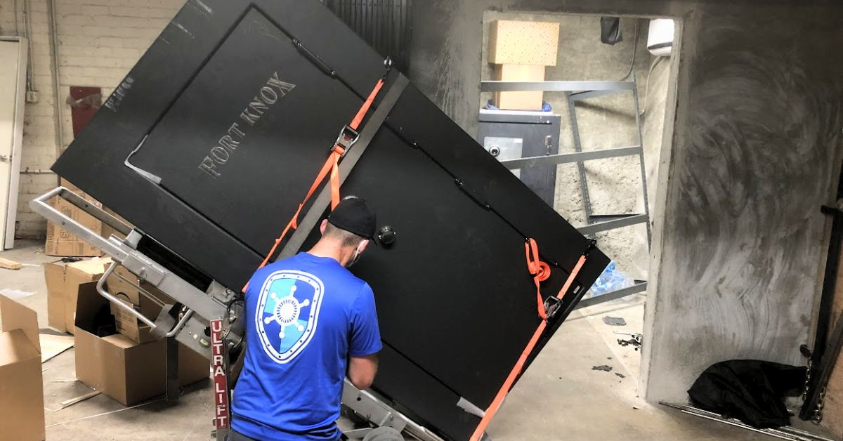 Gun safe being moved through an interior route