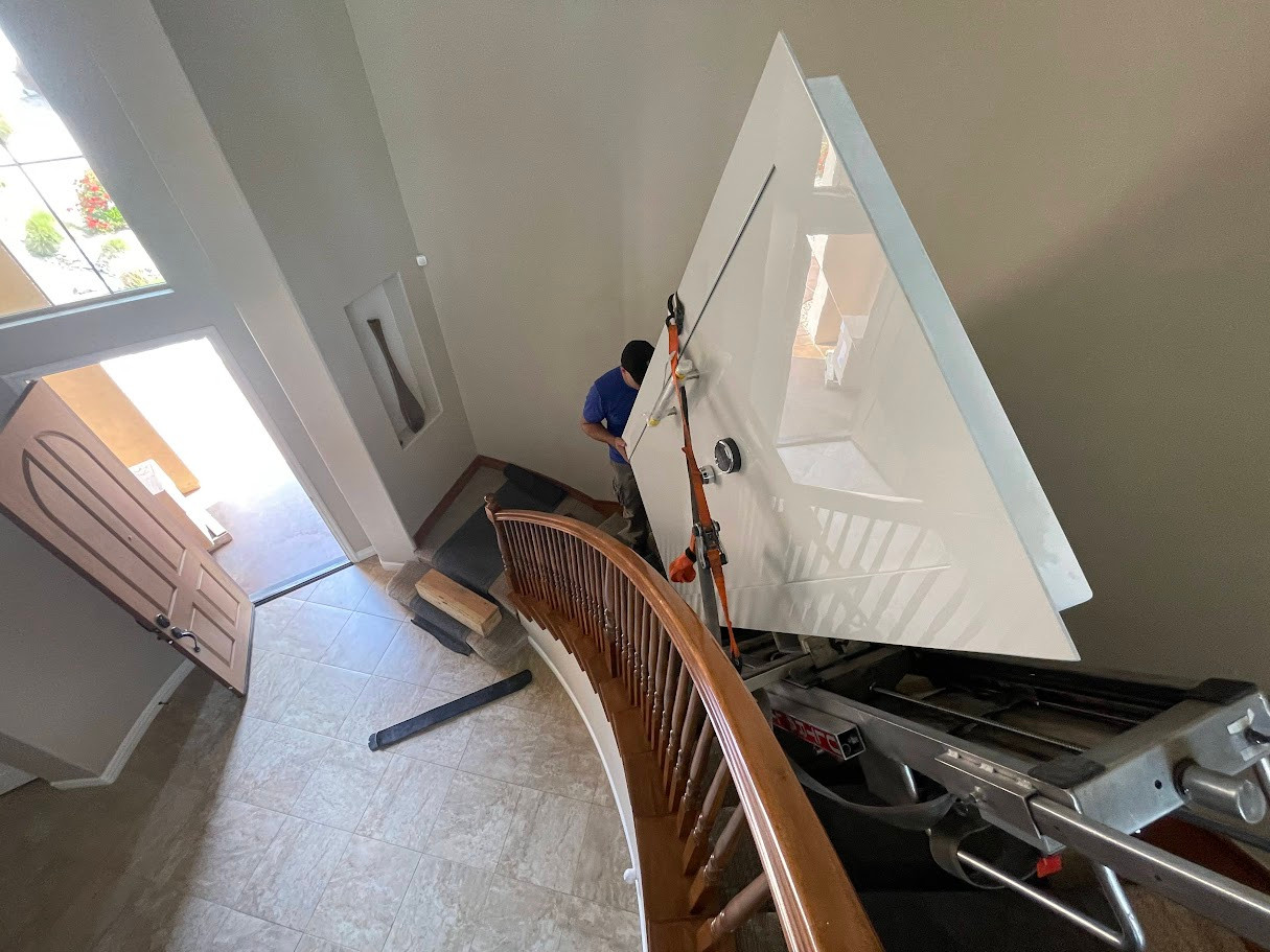 Vault door being moved through a staircase route