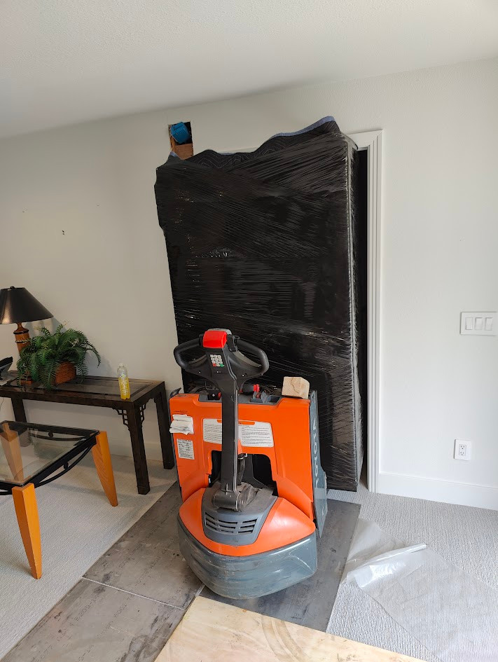 Representative Boswell residential safe delivery using an indoor pallet jack