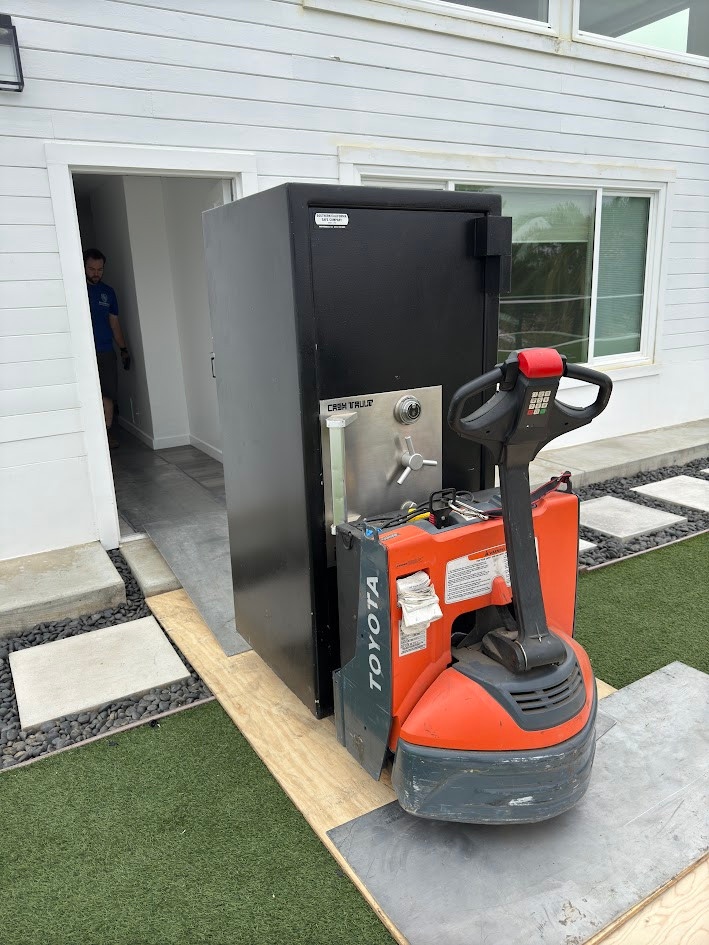 Boswell safe moving crew moving a safe with specialized equipment at a residence