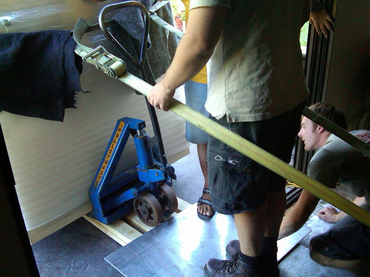 Boswell crew moving a safe through an outdoor access route