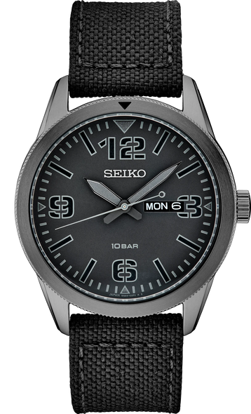 This Seiko watch has a very easy-to-read black dial inspired by old pilot watches. It features a 43mm diameter PVD plated stainless steel case that is only 10mm thick. It is light weight too at just 74 grams. For telling time in the dark, the hour and minute hands are filled with gray Lumibrite as are the four triangles on the blue dial. The crystal is scratch resistant Seiko Hardlex mineral glass. The fixed bezel has a black triangle at the 12:00 position. Powering the watch is a Seiko Caliber 6N43 quartz movement that runs on a battery. The strap is a nylon weave with a leather backing. It is a handsome watch with a stealth military look.