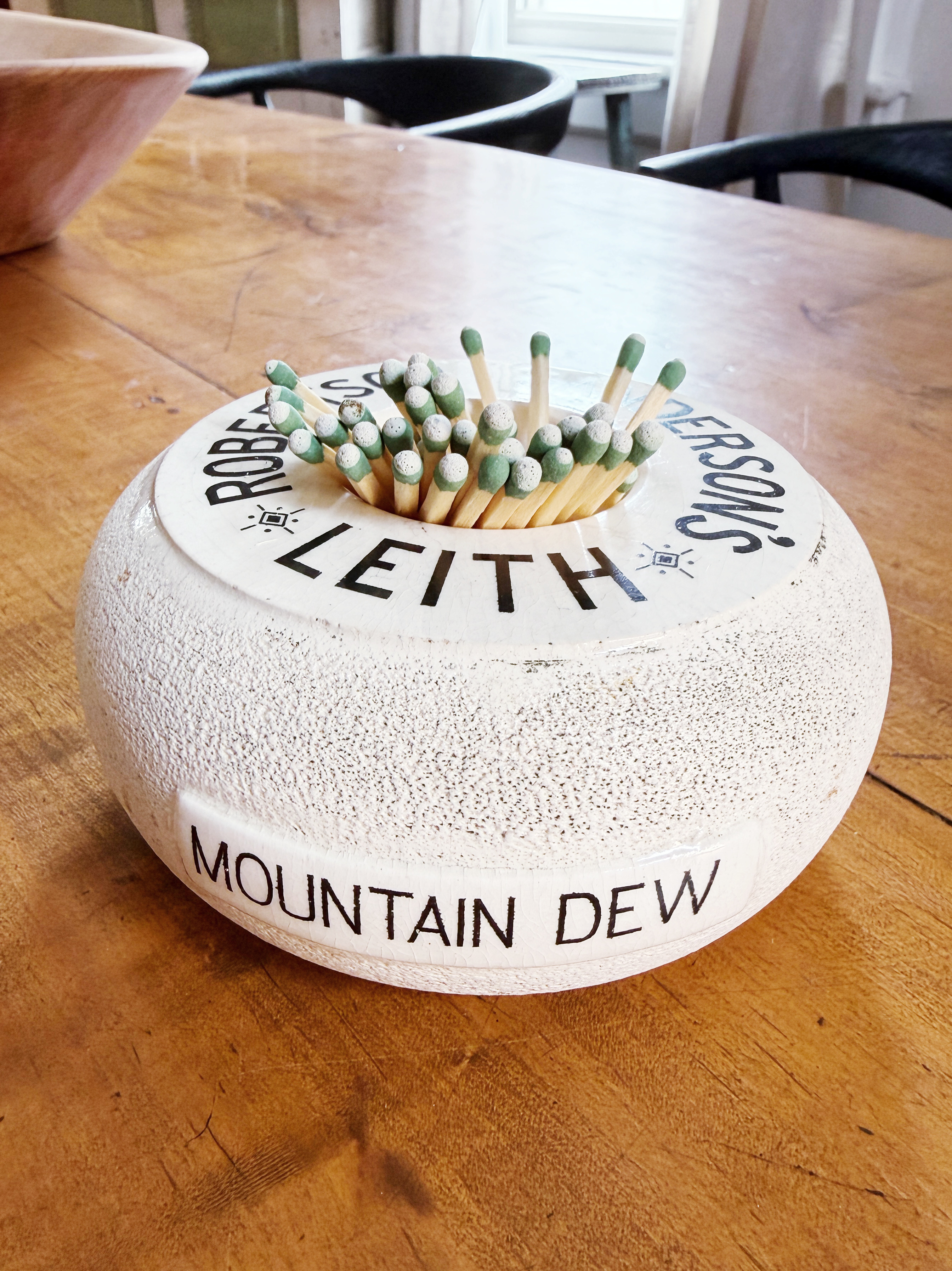 Antique English Mountain Dew Advertising Match Striker