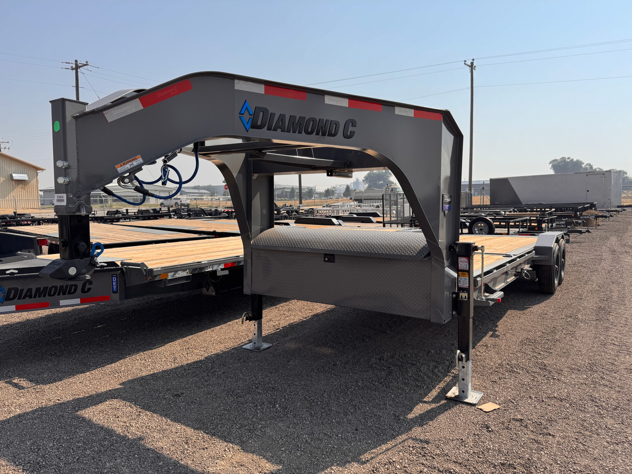 Diamond C Trailers 2026 HDT210 24' Tilt Trailer | Tandem Axle Axle 23K, Engineered I-Beam, Dual Jacks, Full Width Storage, Steel Diamond Plate Fenders, Spare Tire Mount
