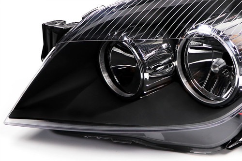 Headlight left black Vauxhall Astra H 04-07