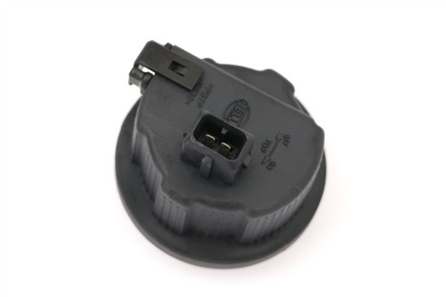 Headlight dust cap with plug