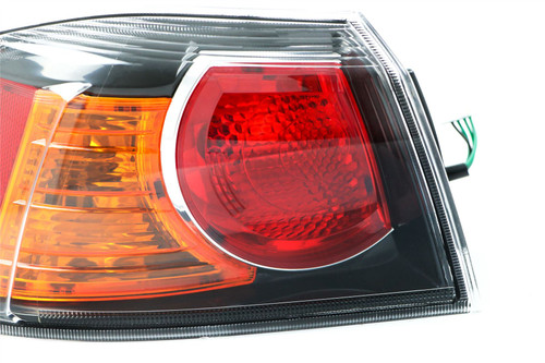 Rear light left black Mitsubishi Lancer 10- Saloon