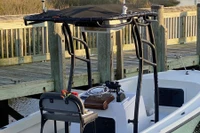 Rear view (zoomed in) of this customer's SG900 boat t-top shows plenty of vertical height for standing around the helm, lots of extra tubing for holding on, and many options for mounting points for rod holders, lights and antenna.