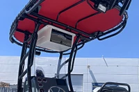 Under side view of the black SG900 premium boat t-top with extra accessory mounting points, e-box, light and rod holders. Red Sunbrella canvas canopy shown.