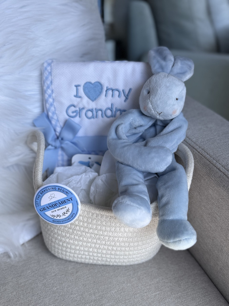 Wicked Stitches' New Grandparent Gift includes a bib embroidered with Grand name, matching burp cloth, binky buddy, cotton storage tote, button.  Gift card is included! 
