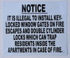 IT IS ILLEGAL TO INSTALL KEY- LOCKED WINDOW GATES   SIGN