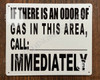 IF THERE IS AN ODOR OF GAS IN THIS AREA, CALL:_ IMMEDIATELY SIGN