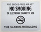 Sign NYC Smoke free Act   AGE "No Smoking or Electric cigarette Use