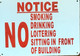 NOTICE NO SMOKING DRINKING LOITERING SITTING IN FRONT OF BUILDING  SIGNAGE