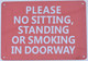 BUILDING SIGNAGE NO SITTING, NO STANDING, NO SMOKING IN THE DOORWAY