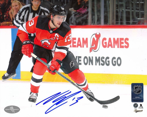Nico Hischier New Jersey Devils Autographed With the Puck 8x10 Photo Nico Hischier New Jersey Devils Autographed With the Puck 8x10 Photo