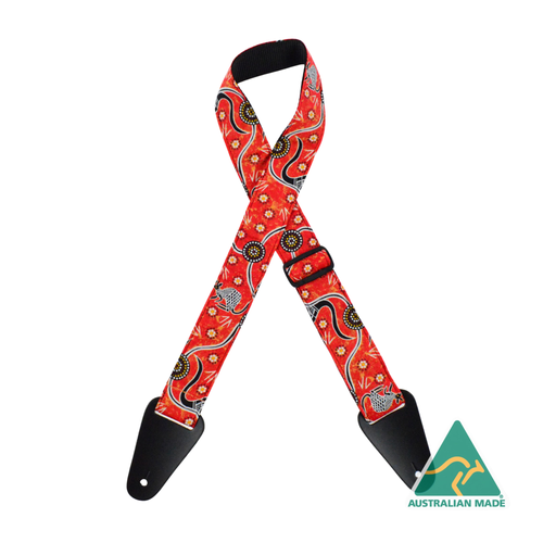 Colonial Leather Aboriginal Art Rag guitar strap in Kangaroo Dreaming Red, featuring Aboriginal artwork fabric sewn onto 50mm webbing with genuine leather ends and adjustable slide hardware.