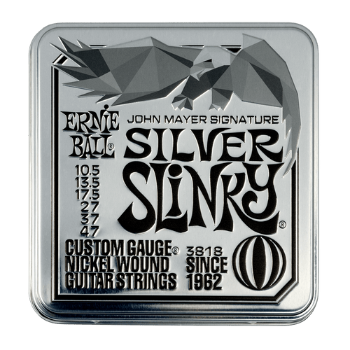 John Mayer Silver Slinky electric guitar strings presented in a collectible metal tin, featuring three sets of custom 10.5–47 gauge strings by Ernie Ball.