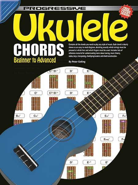 Ukulele chord book showing printed chord diagrams, fingering charts, and music theory explanations, with an included fold-out chord poster visible.