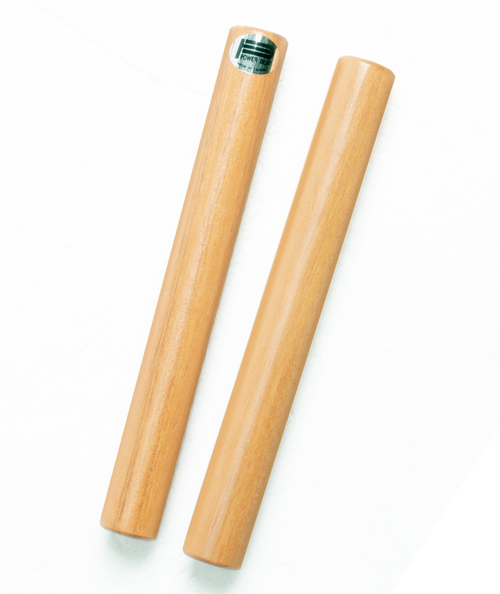 Pair of 8-inch hardwood claves with polished varnish finish designed for classroom rhythm and percussion use.