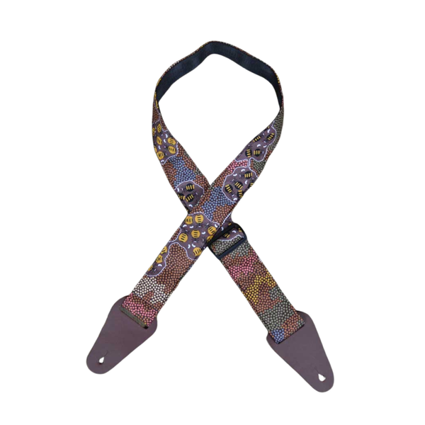 Colonial Leather Aboriginal Art guitar strap featuring Honey Ants artwork in brown tones, sewn onto 50mm webbing with genuine leather ends and adjustable slide hardware.