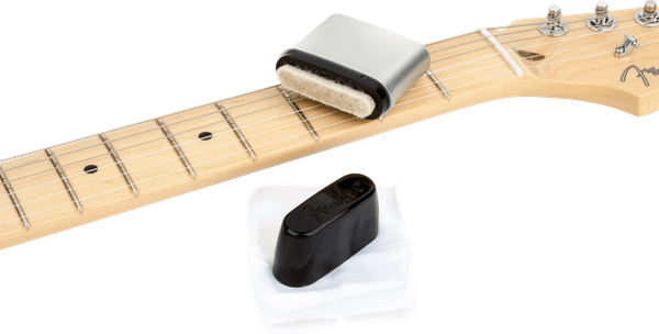 Fender Speed Slick guitar string cleaner applicator with cleaning cloth.