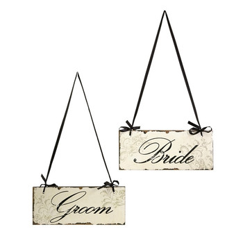 bride and groom hanging wedding signs