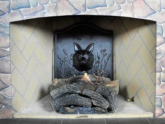 Fireplace with fox emblem