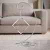 Never Forgotten personalized glass memorial ornament shown on optional display stand