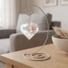 Mother's Love is Forever personalized glass heart memorial ornament shown on optional display stand