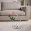 Merry Christmas in Heaven personalized glass memorial ornament shown on optional display stand
