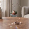 Still Loved personalized glass memorial ornament shown on optional display stand
