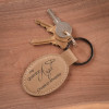 Guardian Angel Oval Key Chain in Light Brown, personalized with loved one's name and dates