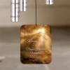 Broken Chain Memorial Wind Chime hanging in a garden, a personalized bereavement gift