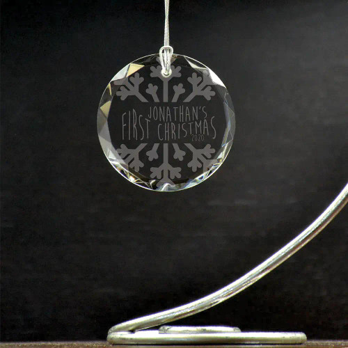 Personalized snowflake theme glass ornament to celebrate baby's first Christmas.