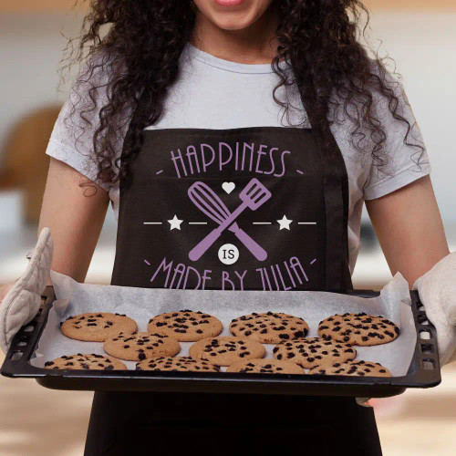 Apron says happiness is made by her and is personalized with first name!