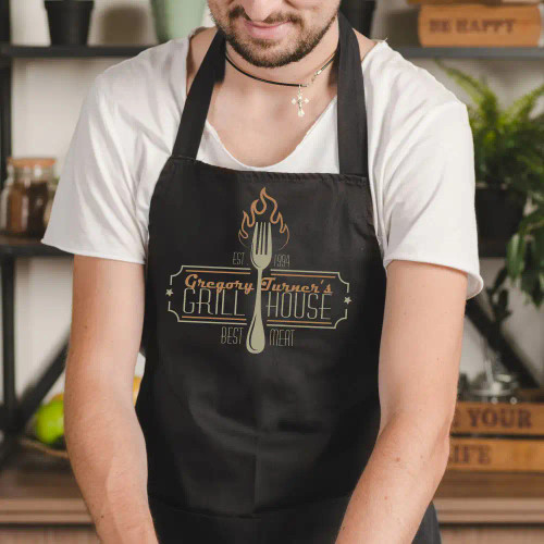 Personalized Apron has his first name and birth year built into the grill house logo