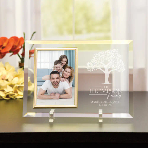 Beautiful engraved glass frame is personalized with family first names and last name and a graphic of a tree