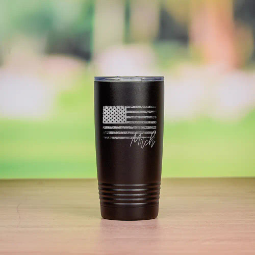 Personalized travel mug with flag has his name on it.