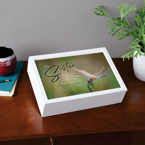 Personalized memorial box has sister's name and dates on the top.