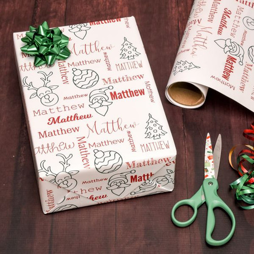 Personalized Holiday gift wrap features name in a repeating pattern and reindeer, Santa, bulb and tree Christmas graphics