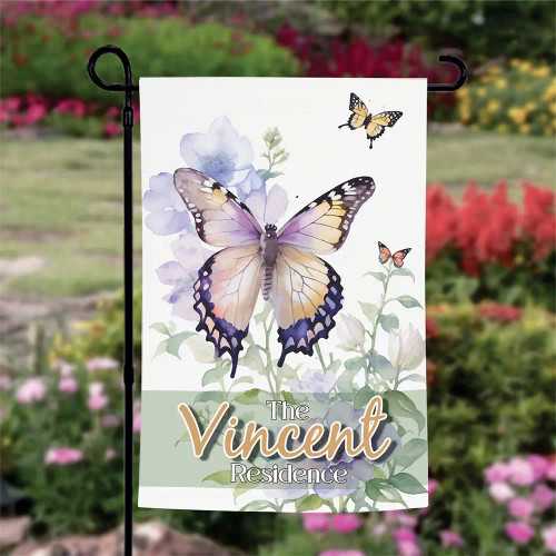 Springtime Garden Flag features a butterfly graphic and  is personalized with family's last name