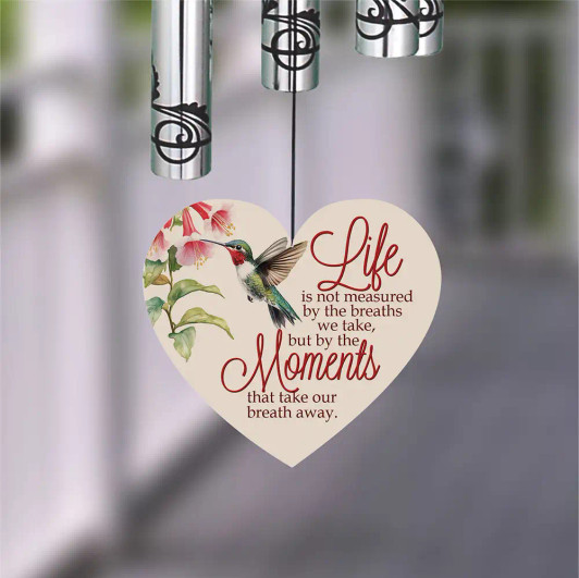 Wind sail is printed with a hummingbird and saying Wind sail is printed with a hummingbird and saying