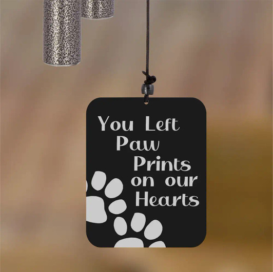 Paw Prints Wind Chime sail engraved with "You left paw prints on our hearts" — pet memorial keepsake