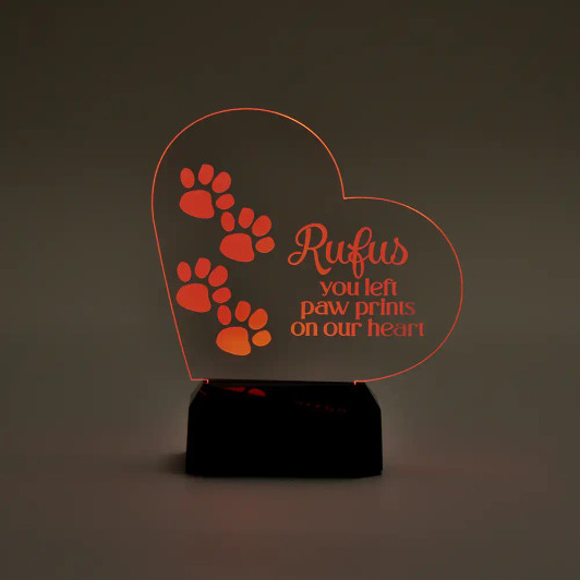 Paw Prints on my Heart Memorial LED Sign for Pets show illuminated in red